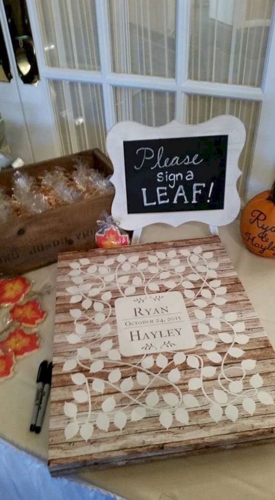 a pallet sign with leaves that are to be signed using a marker is a classic rustic idea