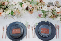 08 The reception table was done with matte grey plates and chargers, delicate blooms, copper cutlery