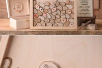 08 a wooden frame with small wood slices and an additional box with these slices is a stylish rustic guest book idea