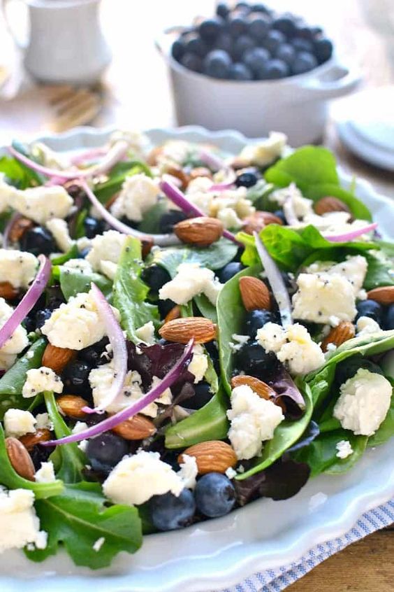 tasty spring salad of blueberries, feta cheese, almonds and with lemon poppyseed vinaigrette