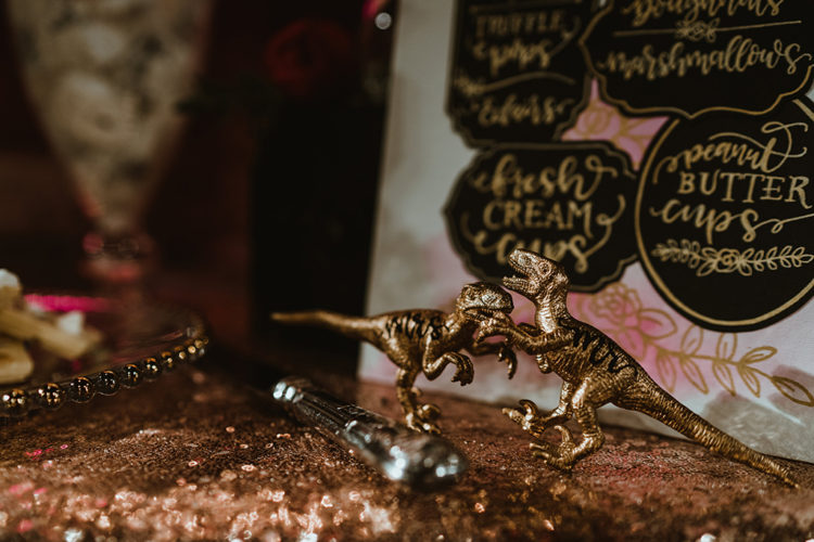 Gilded dinosaurs were placed on reception tables and dessert tables