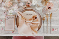 09 The table was all covered with blooms and petals and blush napkins added soft colors to the tablescape