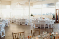 09 The tables were decorated with pastel blooms, gold rim chargers, blush napkins and candles