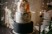 10 The wedding cake was done in white, black and with two abstract tiers with brushstrokes and a ribbon bow