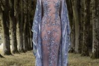 11 a sheer fully embellished blue wedding dress with floral embroidery, long bell sleeves, a high neckline and a nude bodysuit underneath