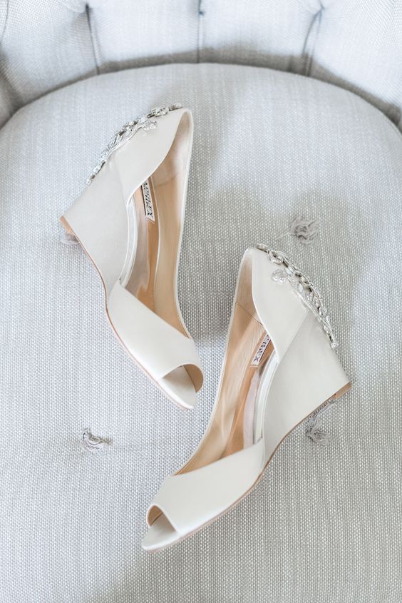 white wedding wedges with peep toes and heavily embellished backs by Badgley Mischka