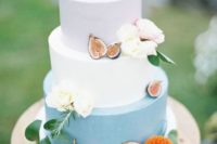 12 a blush, white and powder blue wedding cake topped with fresh blooms and figs