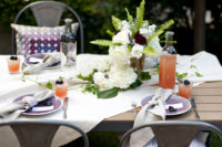 12 a cool table setting for an outdoor backyard bridal shower, fresh blooms and berries for decor