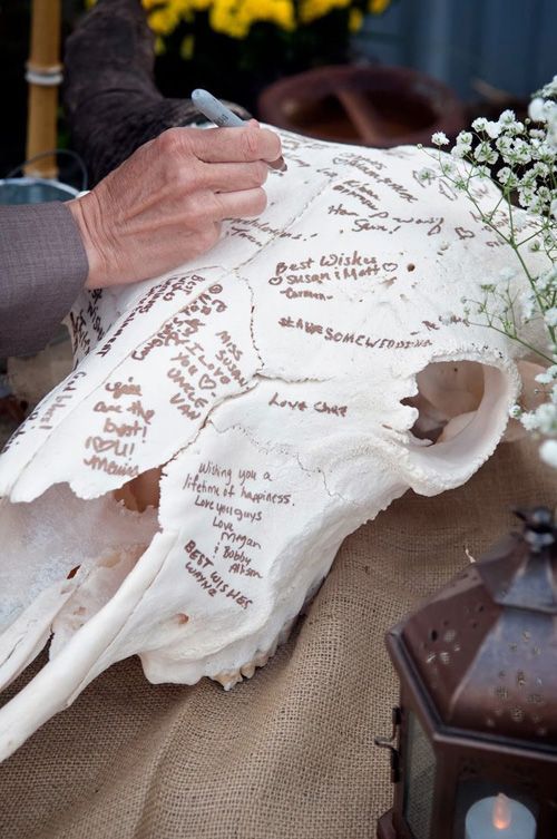 a faux animal skull as a guest book will fit not only a rustic but also a woodland or boho wedding