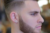 13 a mid fade taper cut with a beard is a bold and modern option that will add style to your look