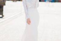 16 an elegant crepe wedding gown with a beaded and sequinned double layer lace top and pearl buttoned sleeves plus a train
