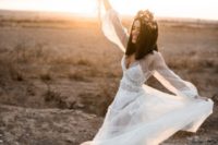 17 a trendy sheer pearl wedding dress with long sleeves and a lace bodysuit under it, printed shoes and a floral headpiece