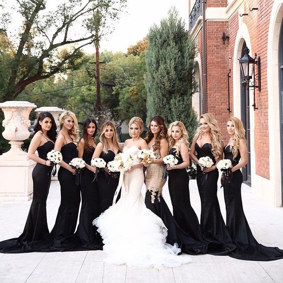 sexy black spaghetti strap mermaid bridesmaid dresses with trains and a strapless mermaid dress with gold sequins on the bodice and a black skirt