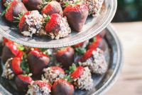 20 a stand with chocolate covered and nut covered strawberries for a nice bridal shower dessert