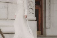21 a turtleneck lace sheath wedding dress with long sleeves and a train for a modern and modest bride