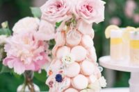 25 a blush mini macaron tower with fresh and sugar blooms and fresh pink roses on top