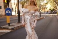 a cute and girlish off the shoulder wedding dress with lace applique, long sleeves and a train is amazing for a wedding