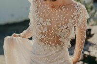 a fantastic naked wedding dress with strategically placed lace applique, pearls and beads and a compltely sheer bodice