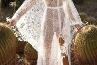 a naked boho wedding dress of crochet lace, with bell sleeves and a long train plus lacing up is a cool idea for a boho wedding
