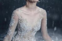 a naked wedding dress with embellished snowflakes that cover the whole wedding dress is a lovely idea for a winter bride