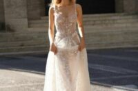 a romantic naked wedding dress with a sheer bodice and skirt, lace applique and beading plus a train is a beautiful idea