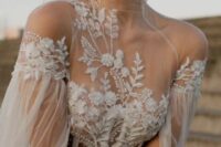 a sheer bodice with strategically placed lace applique and a high neckline is a very romantic and sexy idea for a wedding