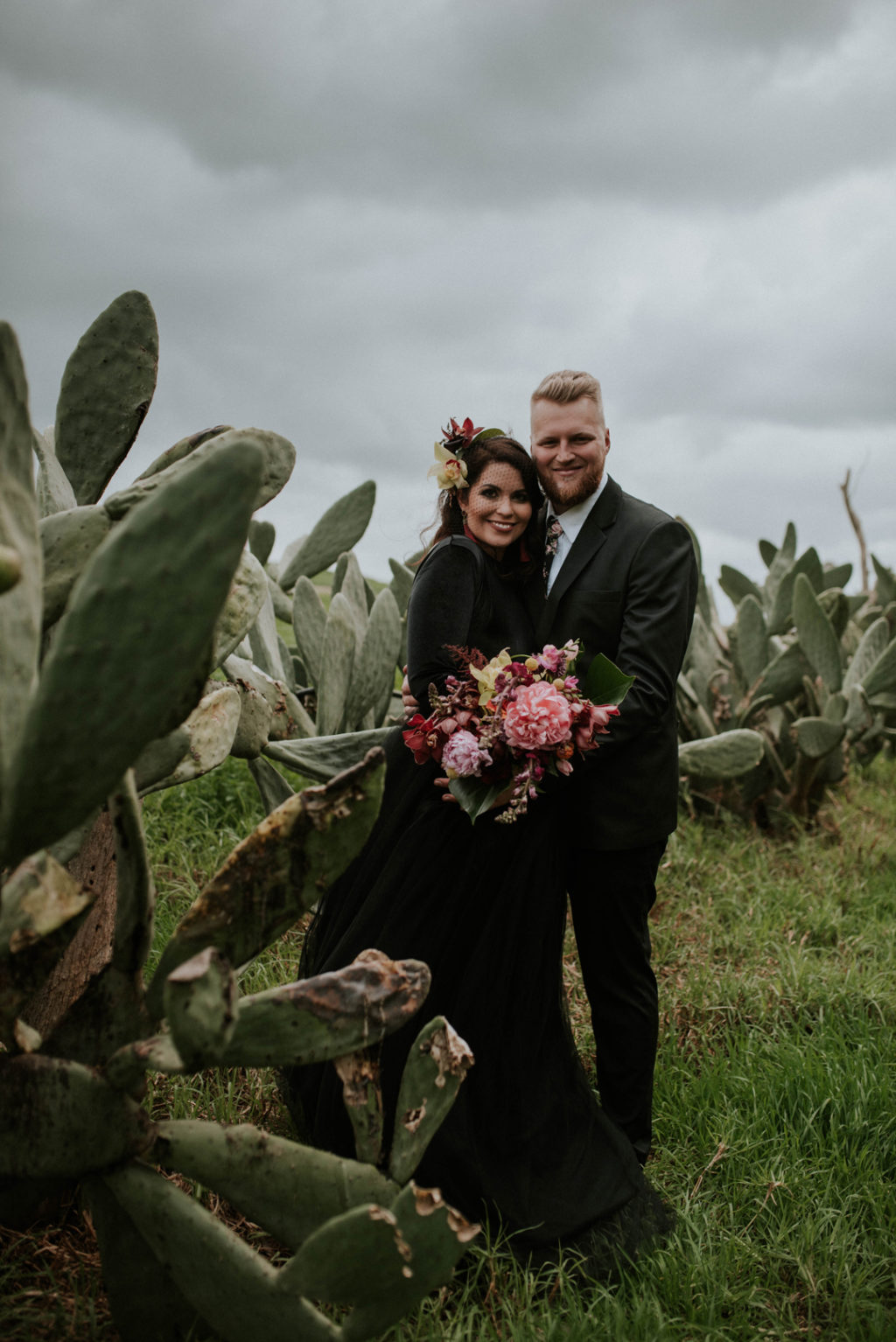 This moody wedding took place in Cape Town and was moody, yet done with bright orchids and other bright blooms