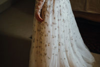 02 The bride was wearing a fully embellished wedding dress with an illusion neckline, long sleeves