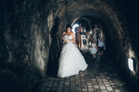 02 The bride was wearing an A-line strapless wedding gown with a draped bodice and an embellished sash plus a half updo