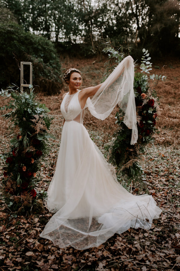 The wedding dress was a halter neckline one, with illusion inserts and a cape plus a train