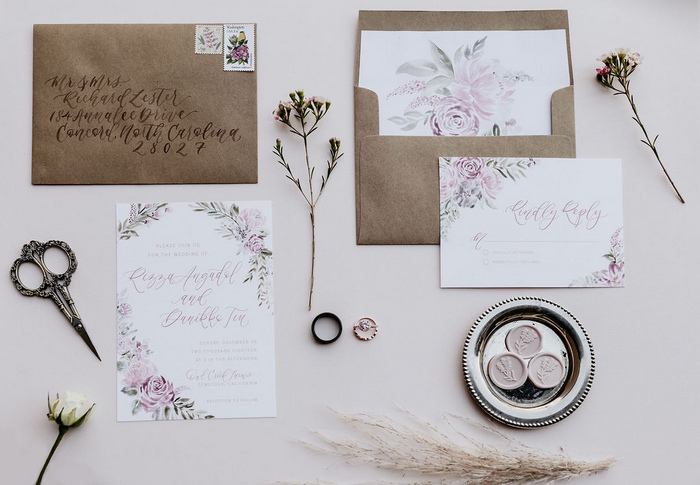 The wedding stationery was simple, with kraft paper envelopes, floral painted invites