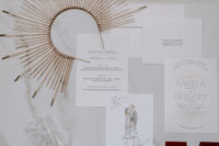 The wedding was spruced up with sunburst motifs – the headpiece, the backdrop and the stationery were done with them