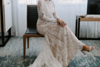 03 The bride was wearing a creamy lace wedding dress with long sleeves, a high neckline, a trian and white block heels