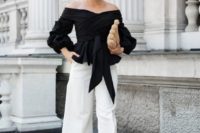 04 white culottes, a black off the shoulder draped top with long sleeves and ties, black heels and a creative bag