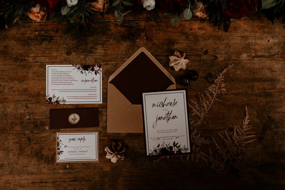 The wedding stationary was moody and was done in classic fall colors