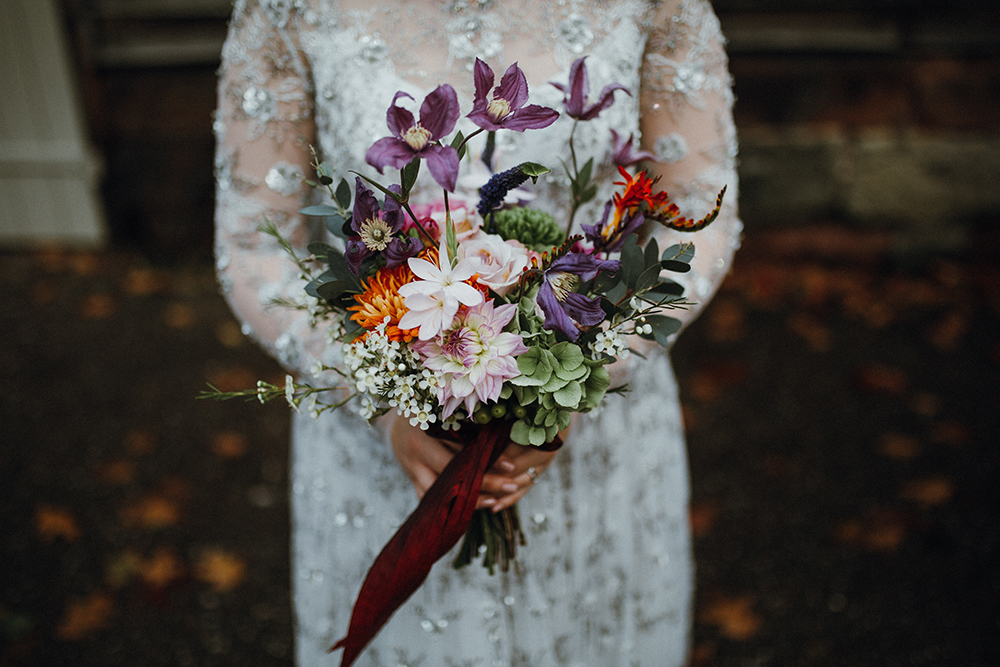 The bridal bouquet was bright and textural, in lilac, orange, blush and green
