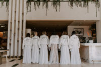 06 The girls covered up with white leather jackets that were calligraphed with names