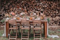 07 The wedding table setting was done in earthy tones, it featured an uncovered wooden table and wooden chairs
