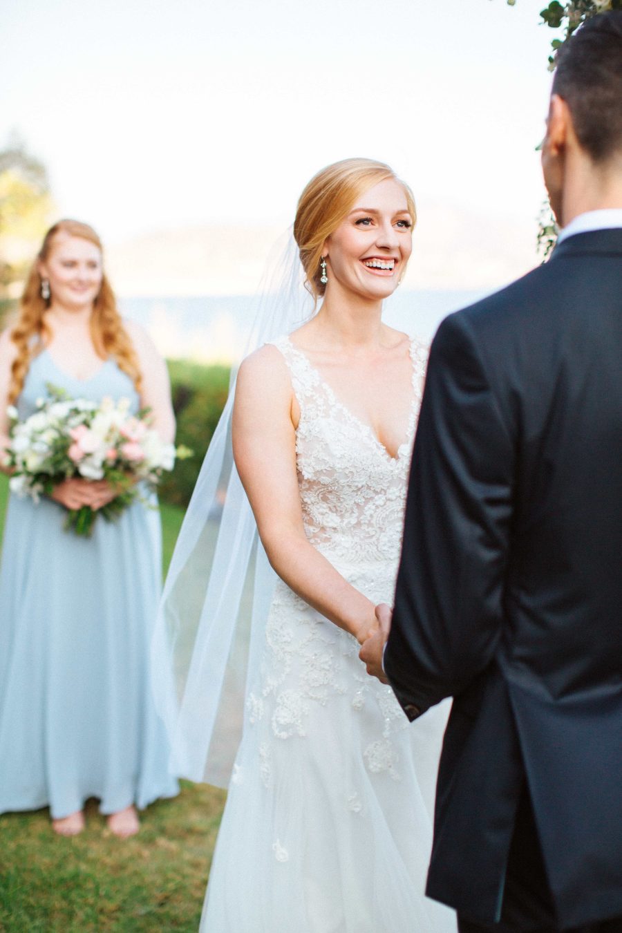 The bridesmaids were wearing light blue maxi dresses and statement earrings