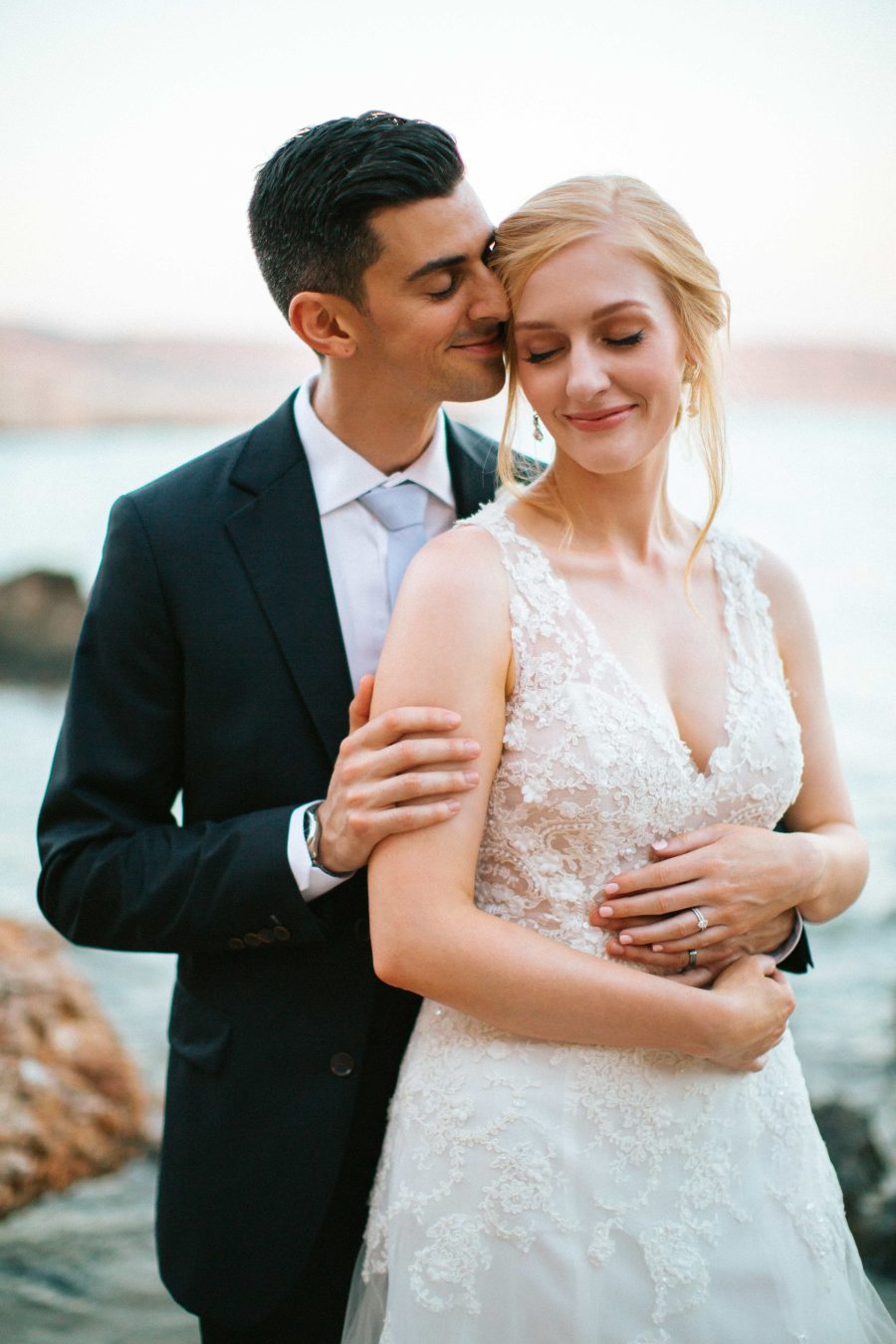 The couple went for some tender and romantic wedding portraits on the seashore