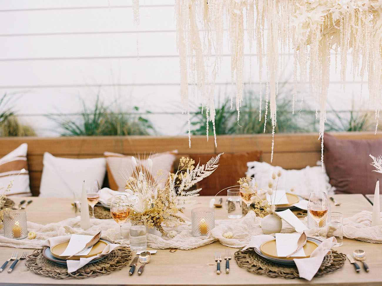 Candles and an airy table runner added chic to the reception table