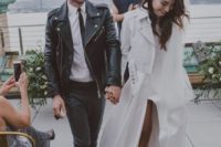 12 grey pants, a white shirt, a black leather moto jacket, black shoes for a modern and hot groom’s look