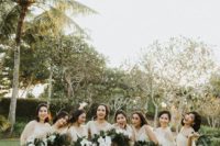 12 mismatching neutral midi bridesmaid dresses with polka dots and various sandals for a modern tropical wedding
