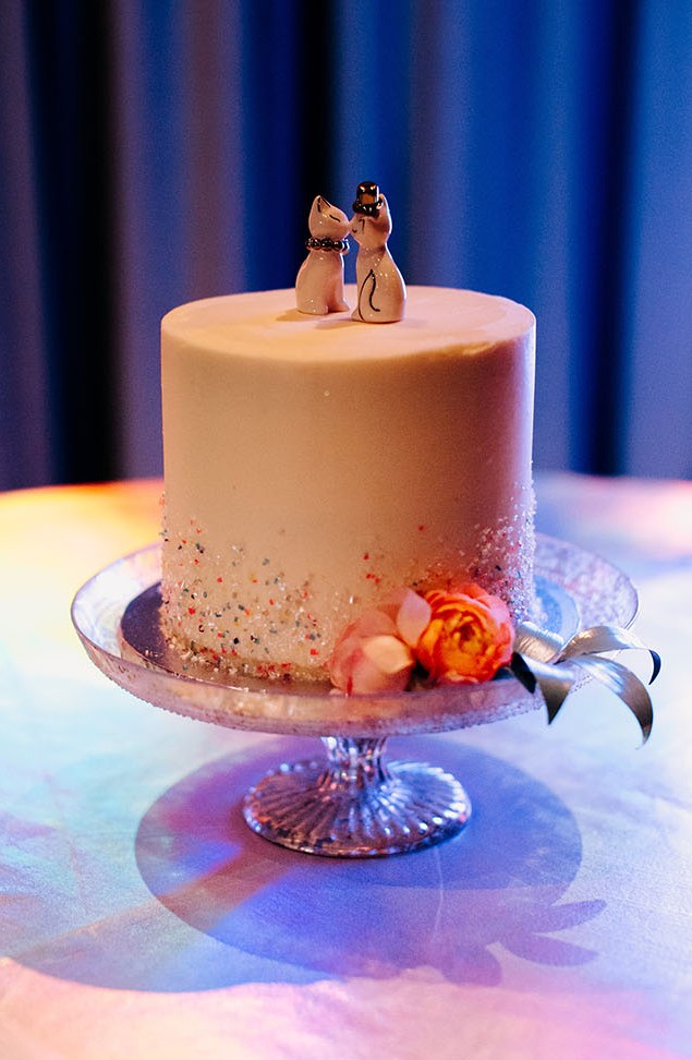 The wedding cake was topped with cute cats, too
