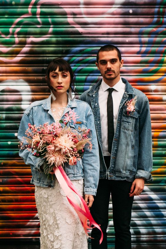 a distressed denim jacket instead of a usual blazer plus a pink floral boutonniere for a fun touch