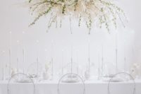 19 an ethereal white bloom and greenery wedding installation instead of a usual wedding centerpiece