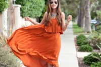24 an all-pleated orange midi dress with leather sandals and a statement necklace create a bit boho