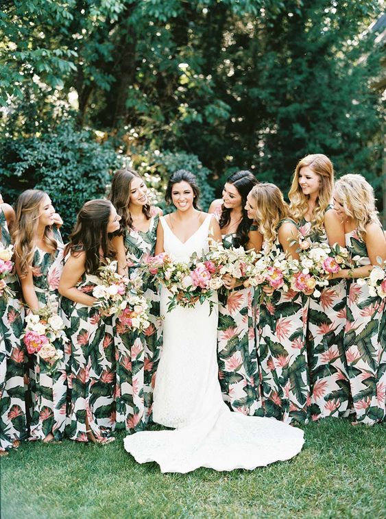 matching thick strap maxi bridesmaid dresses with tropical leaf prints are a timeless idea for a tropical wedding