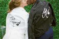 a black denim jacket personalized a bit for the wedding and a matching white jacket for the bride