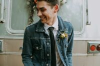 a relaxed boho groom’s look with black jeans, a blue denim jacket, a white shirt and a black tie is coo, easy and fun